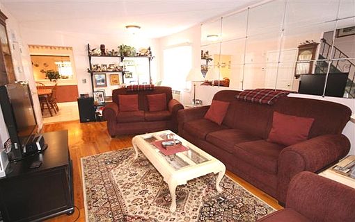 FORMAL LIVING RM WITH HARDWOOD FLOORS THRU-OUT HOME