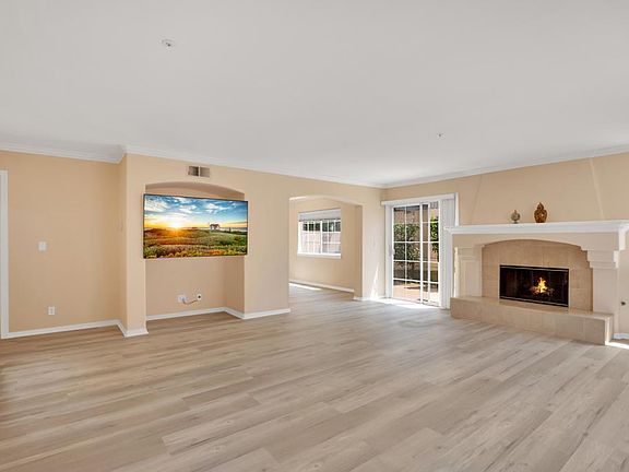 Gorgeous living room view from front door. Brand NEW flooring throughout.