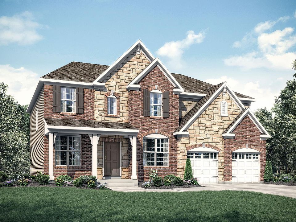 custom home with brick and stone