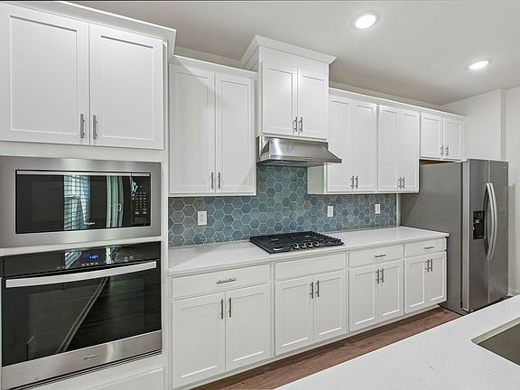 Kitchen in the Lakeland floorplan at a Meritage Homes community in Zebulon, NC.