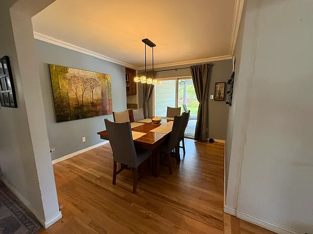 dining room with walk out sliding door to backyard deck