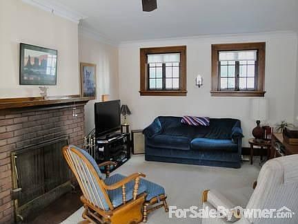 Living Room right of front Entry Way
						:
						Large space with fire place - porch office to left
