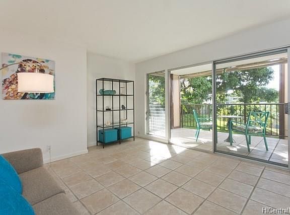 Large living room opens to the lanai and shares the view