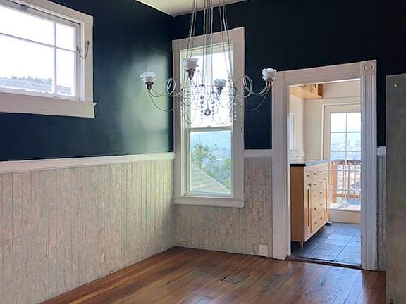 Dining room facing the kitchen and the back of the unit.