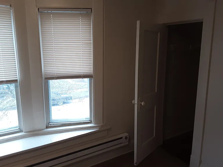 living room entering walk-in closet # one