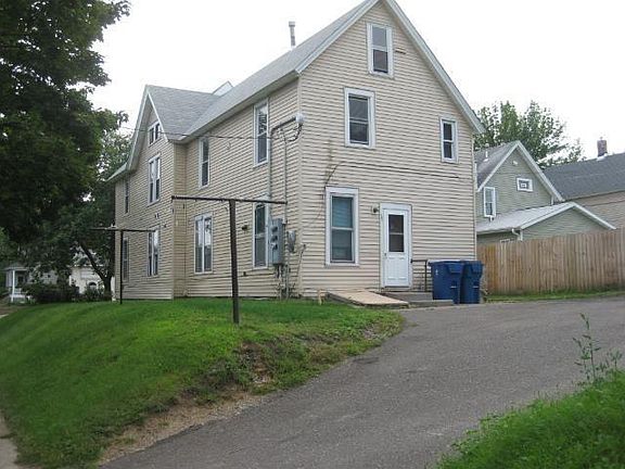 Back of house with off street parking
