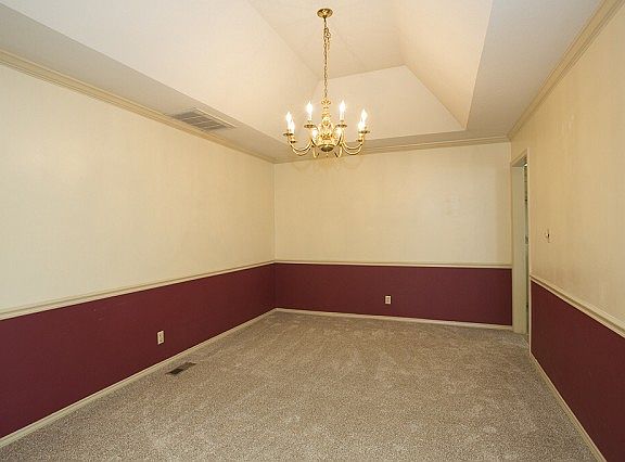 Formal dining with vaulted ceiling