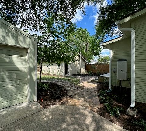 Looking to the back yard with the Rinnai on demand water heater on the wall to the right.