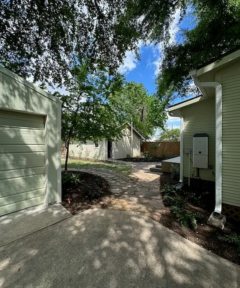 Looking to the back yard with the Rinnai on demand water heater on the wall to the right.