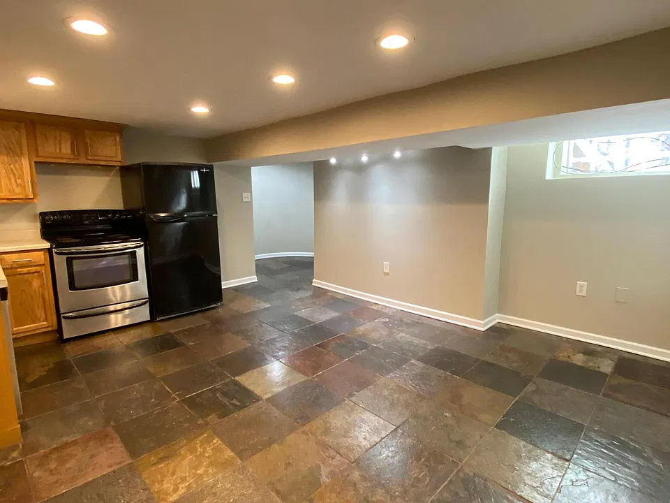 Large kitchen/living/dining space with beautiful slate floors