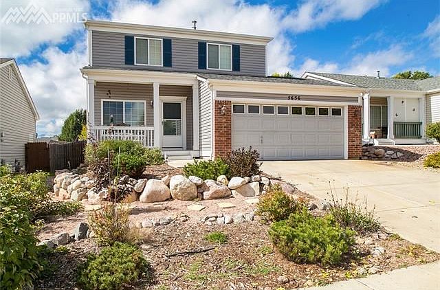 Great mountain and Pikes Peak views from this Pulte Home