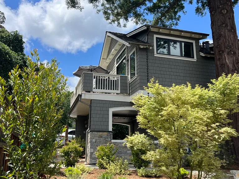 View of the Carriage House from the backyard below.