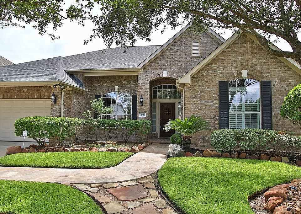 Welcome home to 12735 Briar Harbor Drive in the beautiful community of Village Creek.