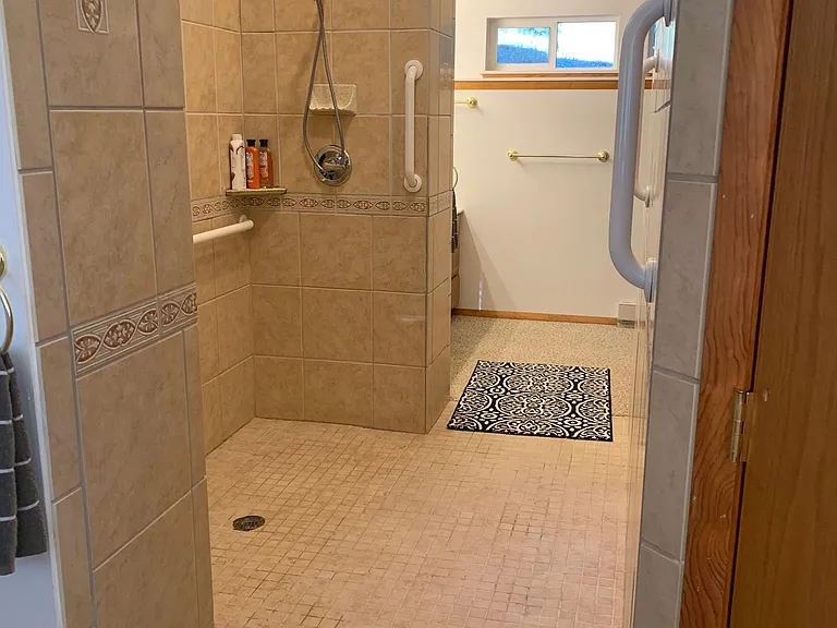Large walk-in shower in primary bedroom suite