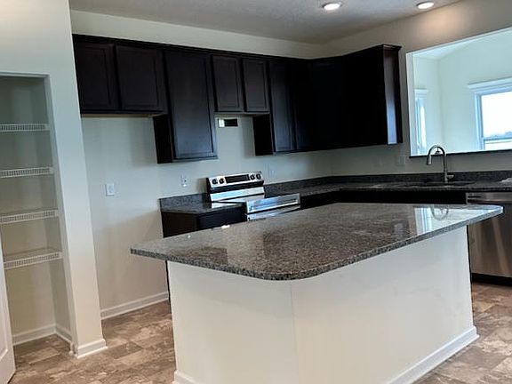 Kitchen with island and pantry
