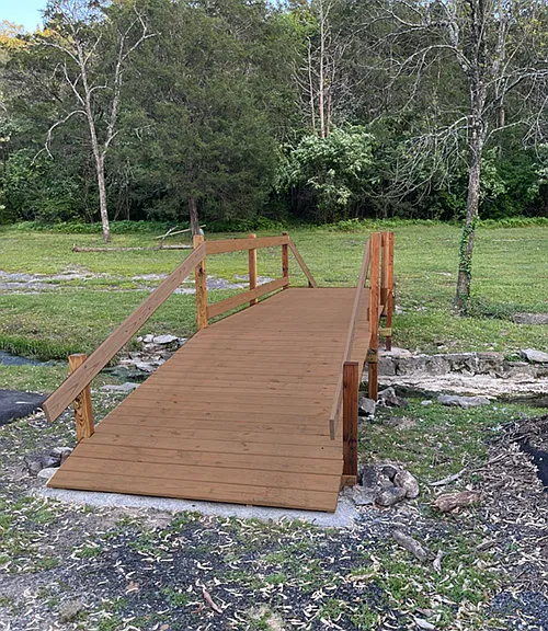 The recently completed bridge is roomy enough to practice yoga or hang out with a friend to watch the water flow underneath.