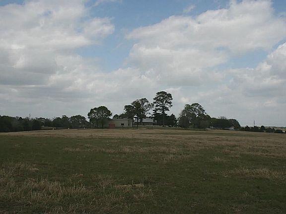View towards front gate/ranch house/barn