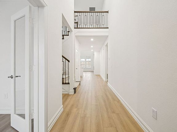 Grand entry with soaring ceilings photos depict features and options that may not be available