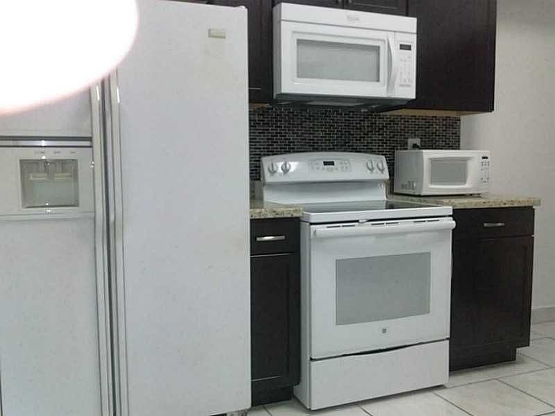 1st image of 611 NW 183rd St