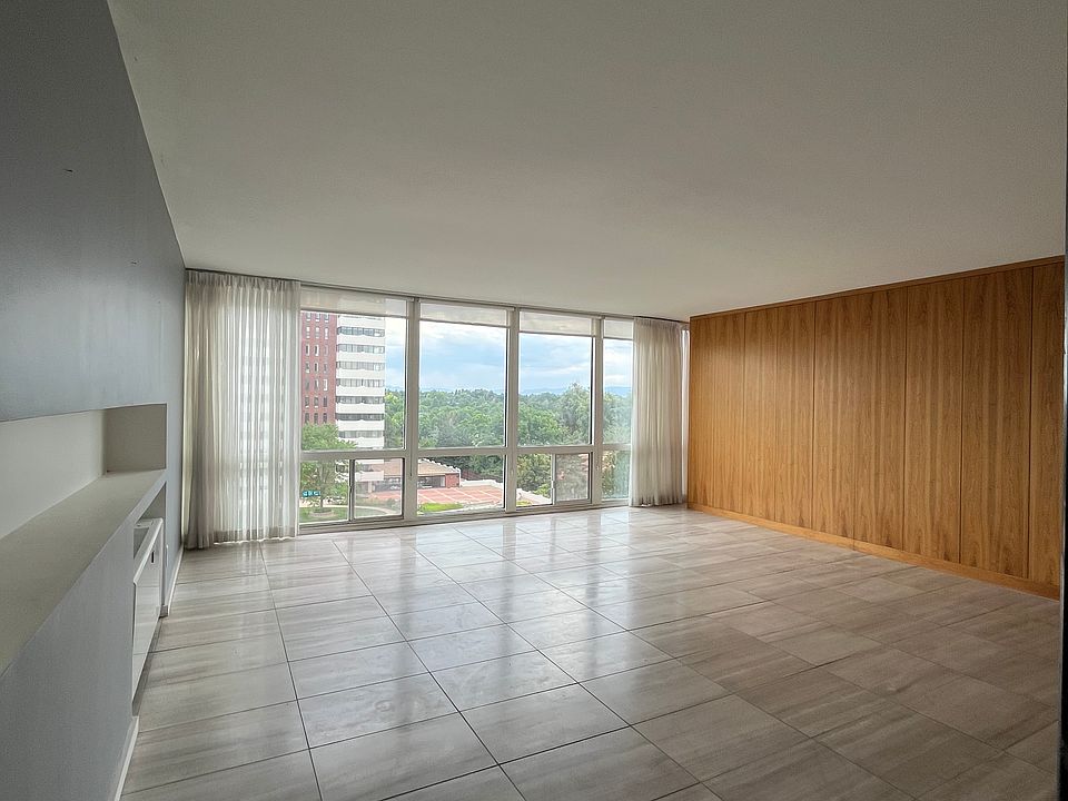 Large living room with beautiful mountain and greenery view