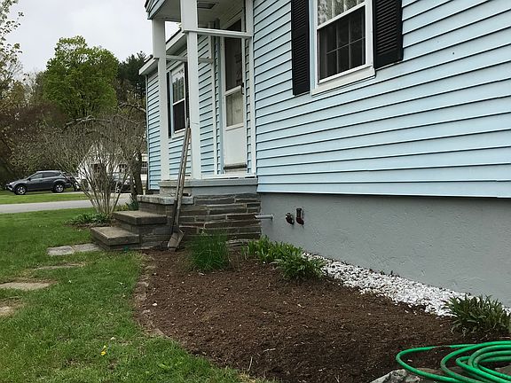 Driveway view, flower beds