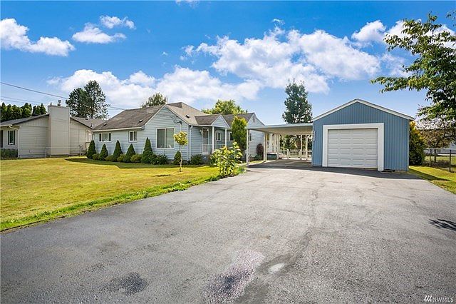 Great curb appeal. Spacious, well maintained yard. Freshly resurfaced driveway. Carport and garage.