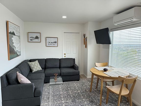 Comfy and cozy couch to watch tv or enjoy the views. The interior door remains locked; there is an empty guest bedroom on the other side that is unoccupied.