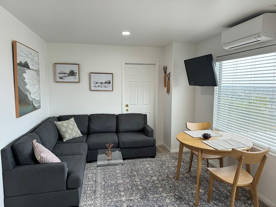 Comfy and cozy couch to watch tv or enjoy the views. The interior door remains locked; there is an empty guest bedroom on the other side that is unoccupied.