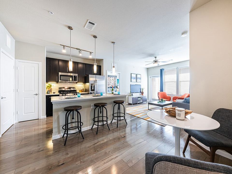 Kitchen, living, and dining area with hard surface flooring