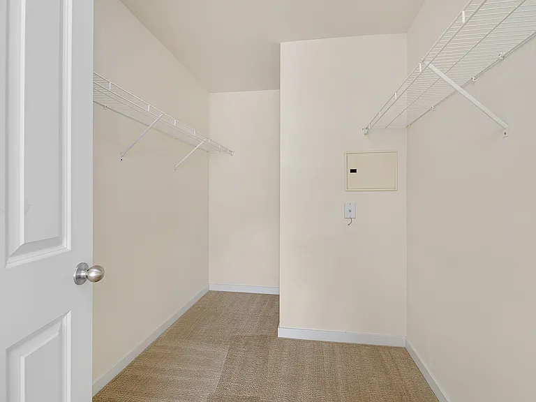 walk in closet in primary bedroom