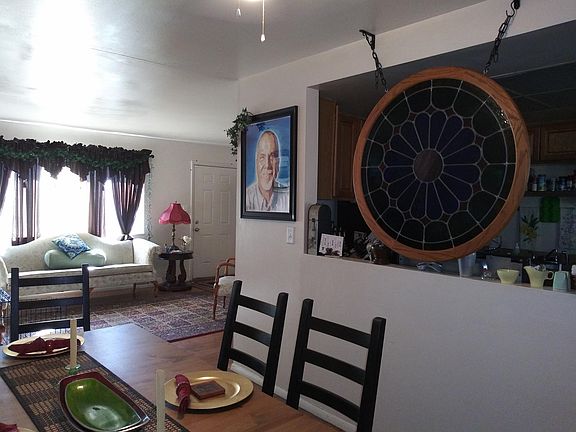 Dining room looking into living room Hard wood floors. See t