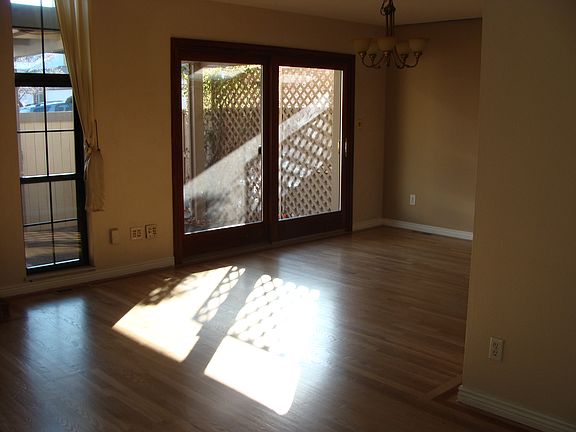 Dining Room with wood sliding glass door to private patio