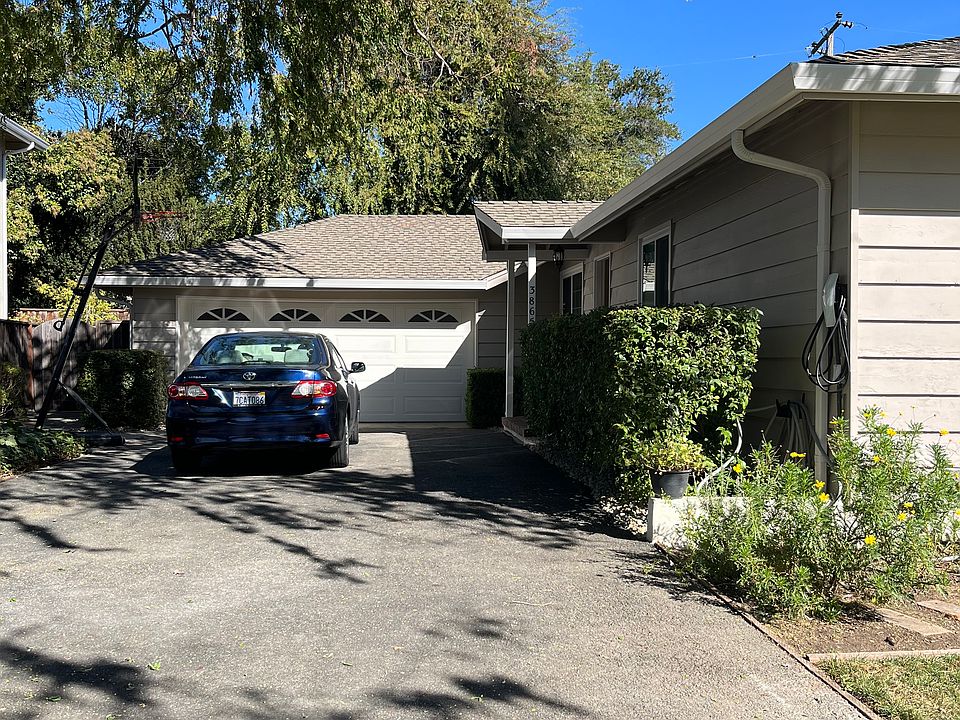 long driveway, 2-car garage with opener