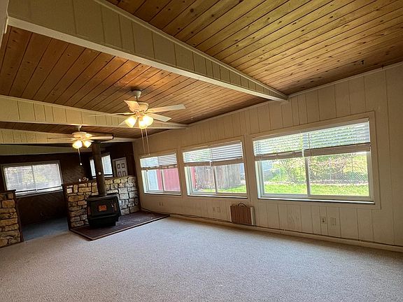 Enclosed finished addition with wood burning stove to warm up the entire house all winter.