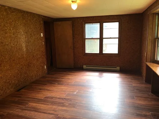 Fireside Room view towards street New Flooring 2019