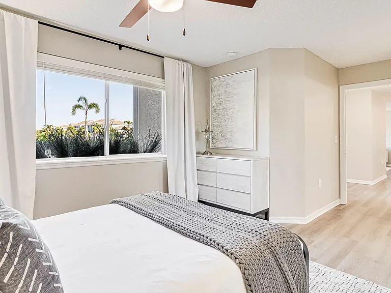 Step into our spacious bedroom, where wood-style flooring or plush carpet cradle your every step.