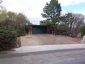 Two car garage with wonderful stamped concrete driveway. 