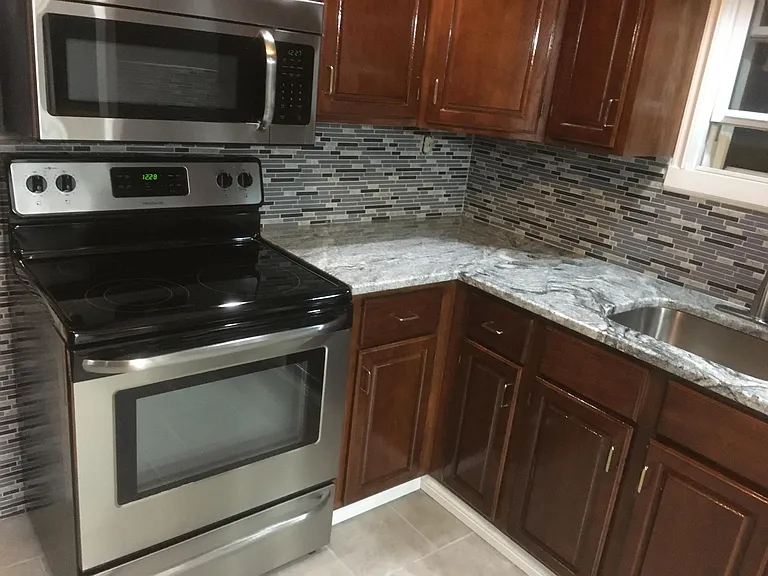 Renovated kitchen, new granite, new flooring, renovated cupboards, updated stainless steel appliances