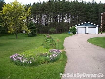 Front yard
						:
						2 garage stall, black top circle drive, landscaping