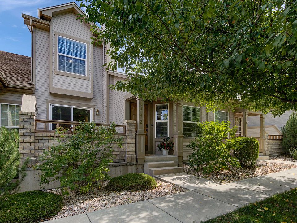 Gorgeous mature trees create shade and a sense of privacy in your front yard.