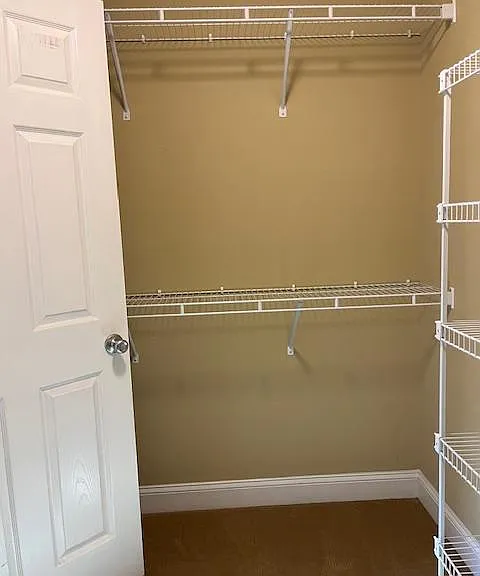 Left side of Walk-in-Closet, door is connects to bathroom. The opposite side of this closet is identical.