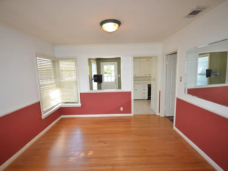 Hardwood-finish flooring throughout the space.