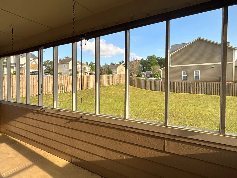 Screened in back porch view to back yard