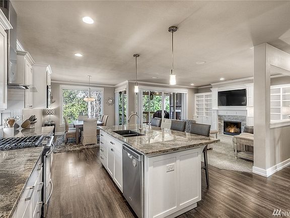 This open concept main floor living area is the heart of the home. Upgraded lighting, granite, and functional layout. 