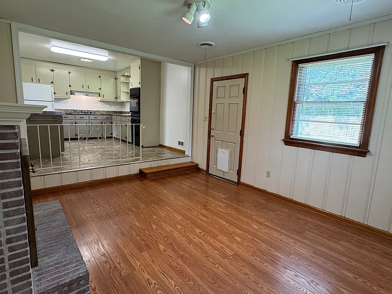Family room and kitchen. Door shown opens to the backyard.