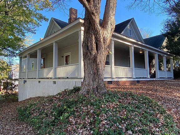 The 4 room apartment shares a common foyer and also has a separate entrance from the side of the wraparound porch at the corner of Linden Ave and E. Lane St.