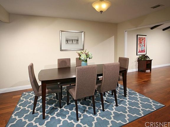 The formal dining room with its newer designer lig