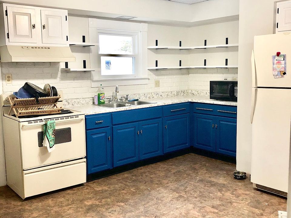 Large, bright kitchen with open shelving and large sit-in dining room attached. More photos to come!