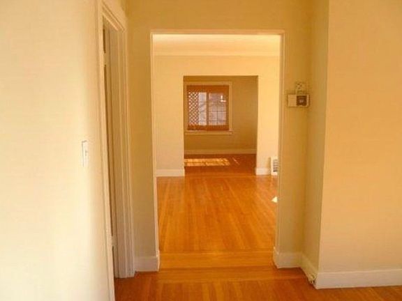 View from den through living room to dining room