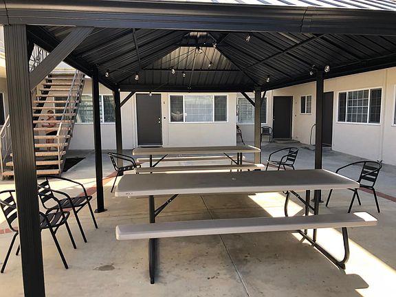 Covered outdoor seating next to the gas barbecues.